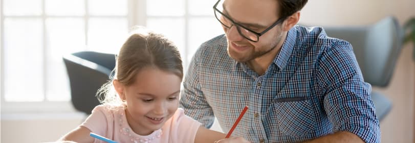 Image of a teacher helping a young person