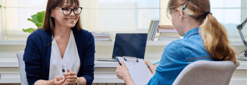 Image of a classroom with young people working