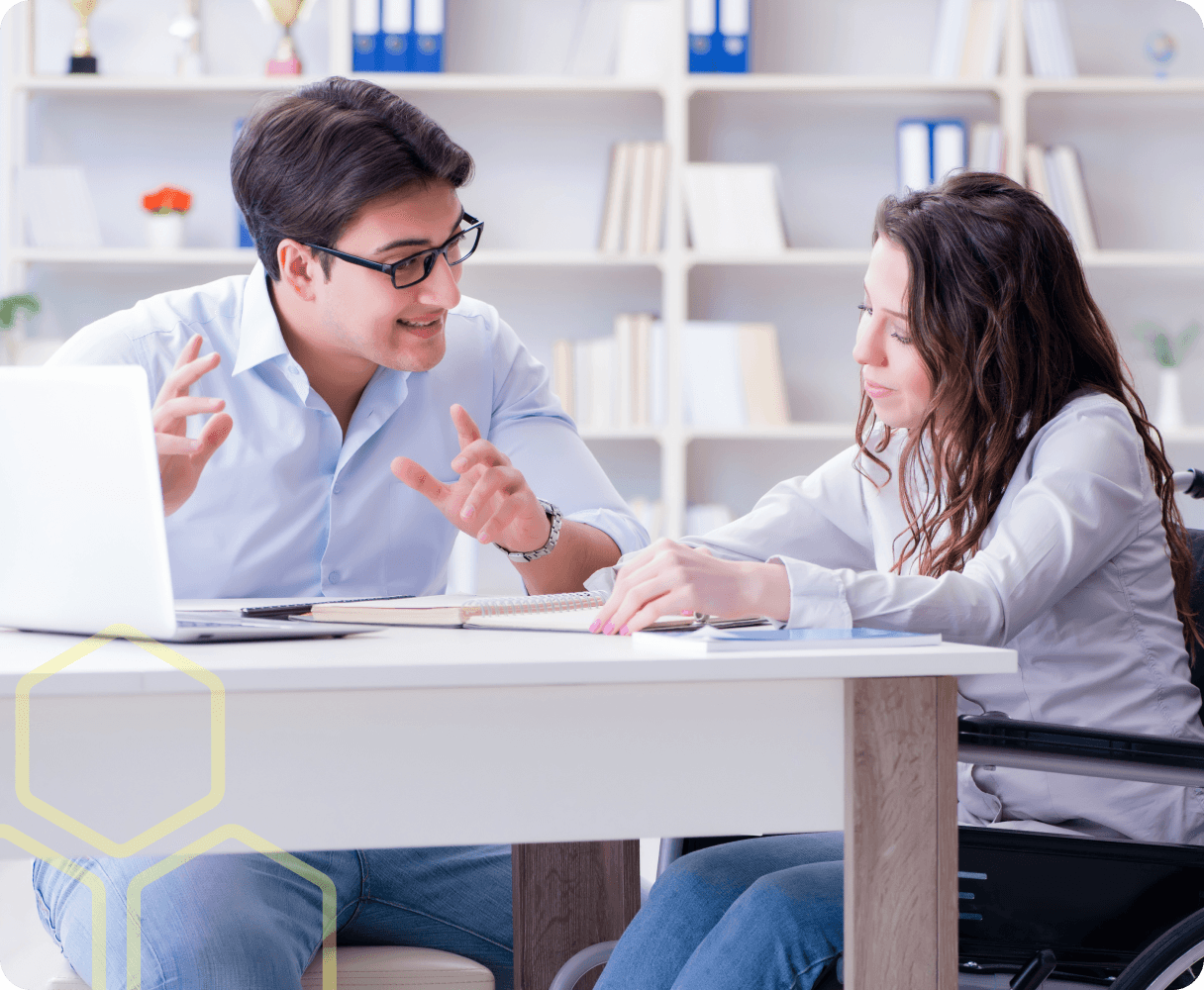 Image of a teacher and young person talking