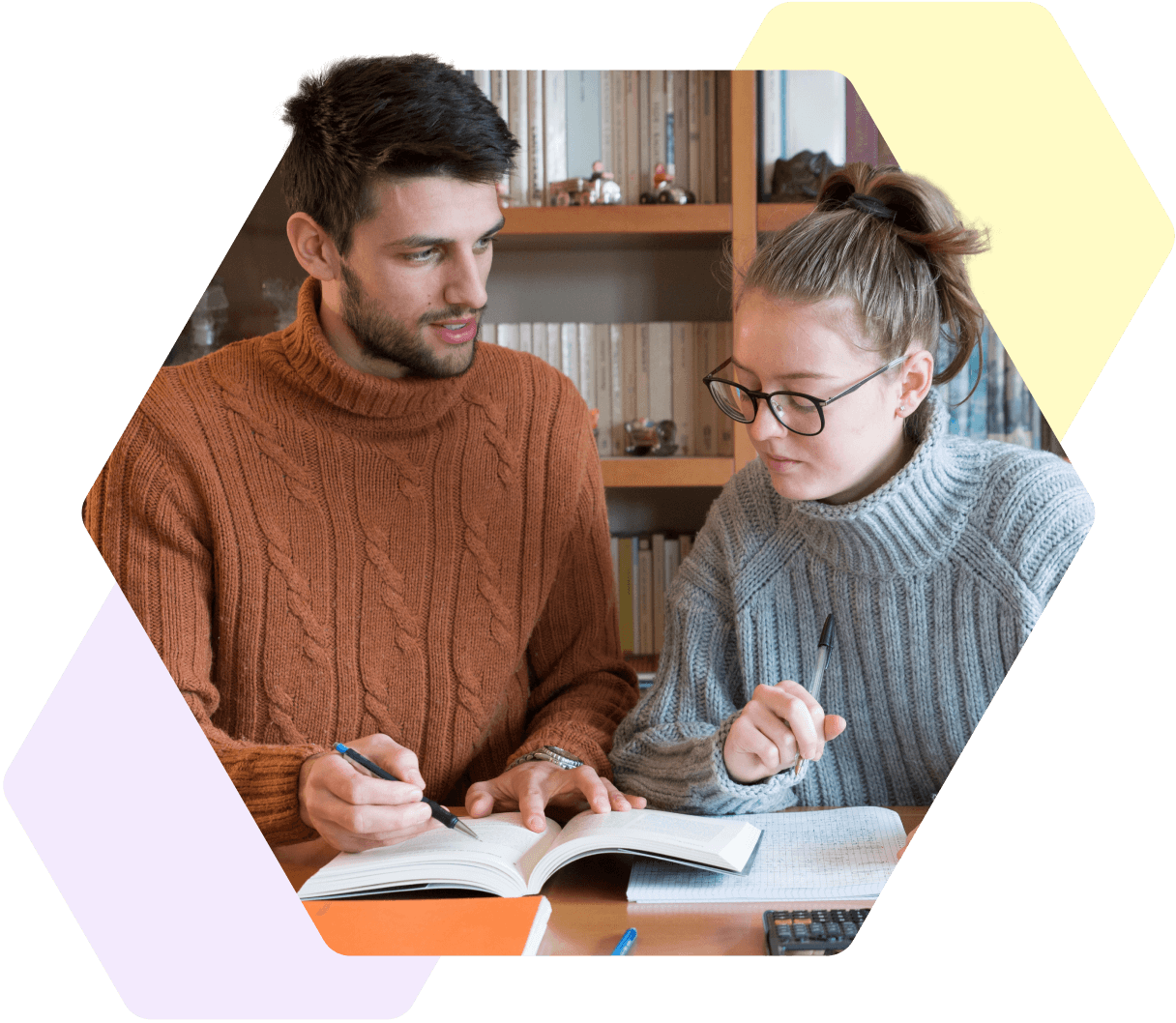 Image of a young person working with a teacher