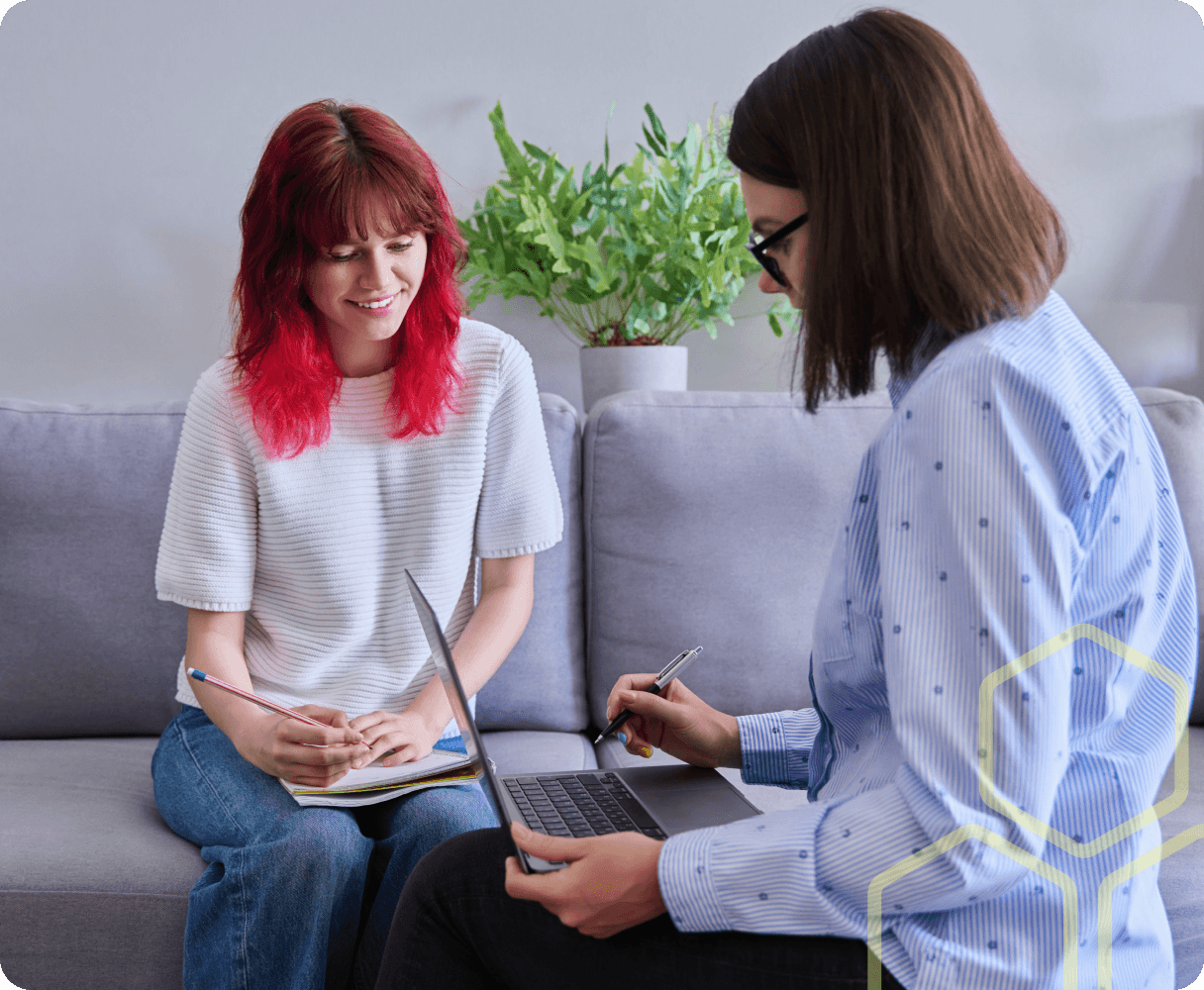 Image of a teacher talking to a young person